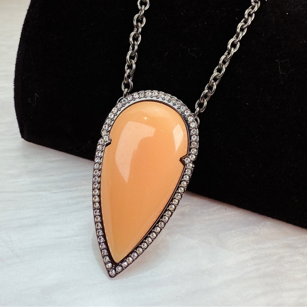 Interesting black gunmetal chain with large Peach pendant